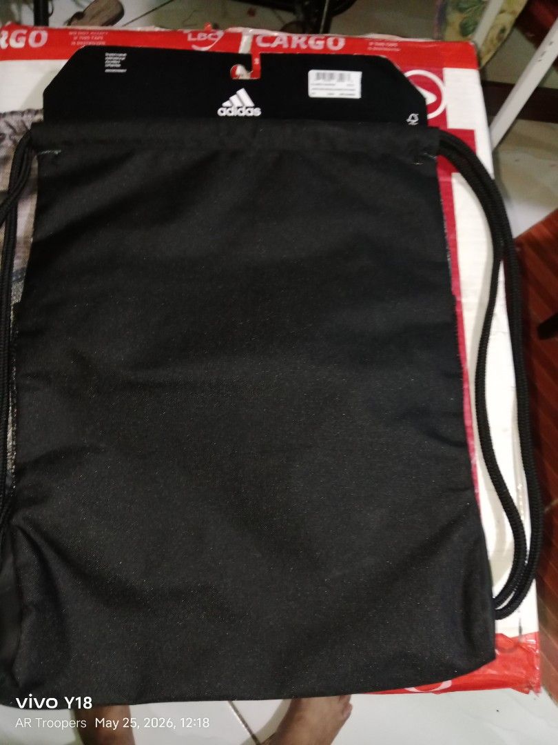 Adidas Alliance 2 Sackpack (Category: Backpacks) located in Cavite. Submitted by elmzcloset (Listing ID 1439840172, Image 3). Description: - Adidas Alliance 2 Sackpack drawstring bag - Gray and black design - Adidas logo and three stripes - Mesh pocket - Drawstring closure - New with tags - Durable material - Ideal for sports gear or everyday essentials.