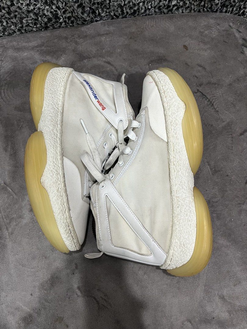 Alexander Wang A1 Logo High-Top Sneaker. | Size 43 (Category: Sneakers) located in General Trias. Submitted by zrchustle.604 (Listing ID 1439858972, Image 2). Description: the Alexander Wang A1 Logo High-Top Sneaker. Key Features Silhouette: Paneled mid-to-high top construction featuring a mixed-material upper made of breathable mesh and leather overlays. Sole: Distinguishable chunky, bubble-like translucent rubber platform sole with textured fox
