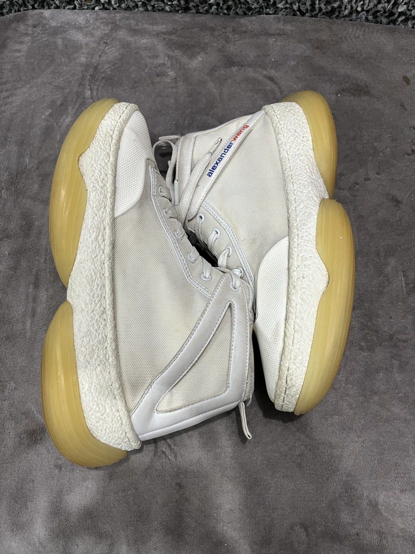 Alexander Wang A1 Logo High-Top Sneaker. | Size 43 (Category: Sneakers) located in General Trias. Submitted by zrchustle.604 (Listing ID 1439858972, Image 3). Description: the Alexander Wang A1 Logo High-Top Sneaker. Key Features Silhouette: Paneled mid-to-high top construction featuring a mixed-material upper made of breathable mesh and leather overlays. Sole: Distinguishable chunky, bubble-like translucent rubber platform sole with textured fox