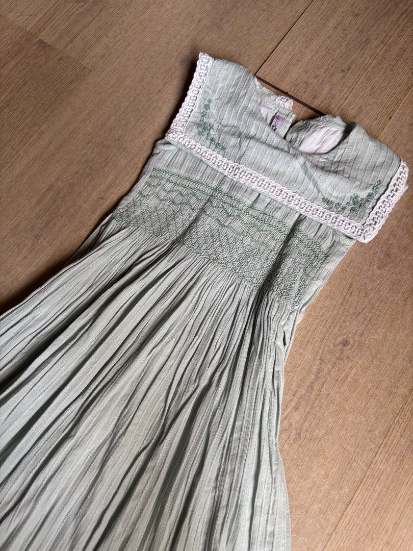Smocked Green Dress Size 8 (Category: Babies & Kids Fashion) located in Cebu City. Submitted by limjennif52235 (Listing ID 1439824144, Image 2). Description: - Ana Rosa green dress - Intricate embroidery and lace detailing - Pleated skirt - Fitted bodice - Round neckline, sleeveless - Size 8 - Perfect for special occasions or everyday wear.