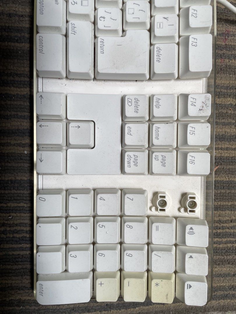 Apple Wired Keyboard with Numeric Keypad (Category: Computer Keyboard) located in Quezon City. Submitted by eilgaraje (Listing ID 1439844478, Image 3). Description: - Apple wired keyboard with numeric keypad - White finish - Includes USB cable - Some keys show wear and tear - Features Japanese characters - Model: A1243 - Includes original cable.