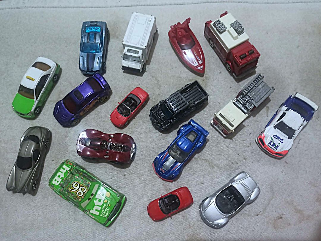 Assorted Diecast Toy Cars (Category: Vehicle & Diecast Models) located in Caloocan City. Submitted by remyetiennelebeau (Listing ID 1439841762, Image 1). Description: - Collection of assorted diecast toy cars - Includes various models and colors - Features a green taxi, blue sports car, red boat, fire trucks, and more - Great for kids or collectors pasay area.