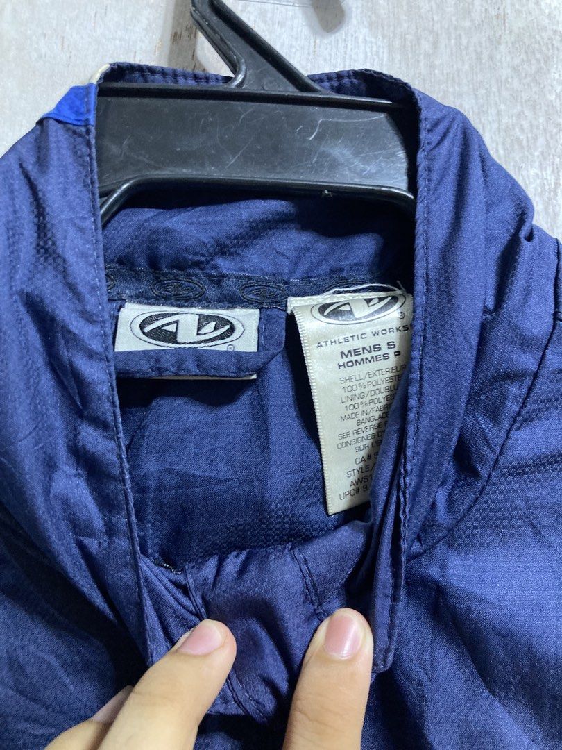 Athletic Works Men's Navy Blue Track Jacket (Category: Coats, Jackets and Outerwear) located in Iloilo. Submitted by __kyleeee__ (Listing ID 1439916500, Image 3). Description: - Athletic Works track jacket - Classic navy blue and royal blue color block design with white accents - Full zip front - Stand-up collar - Perfect for workouts or casual wear.