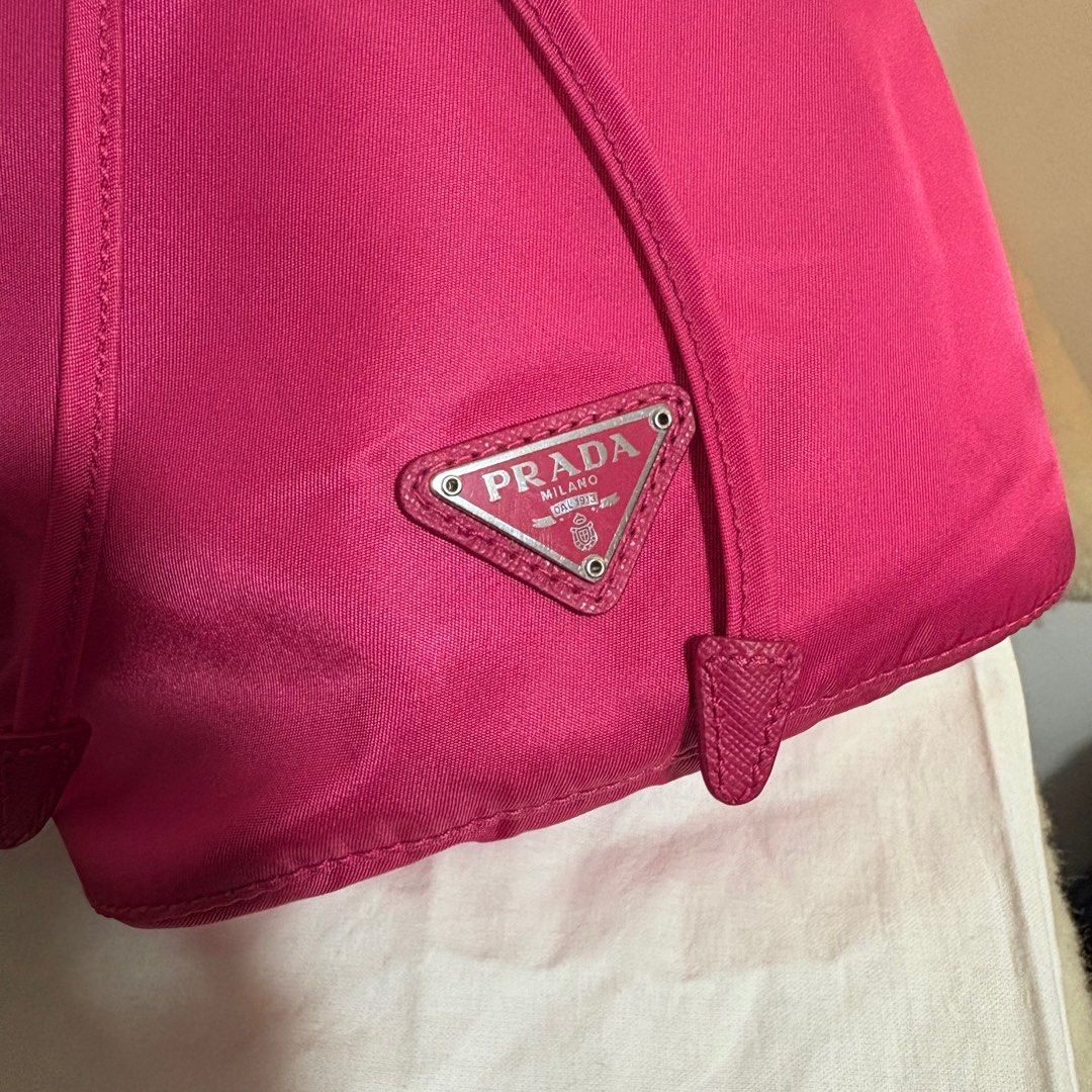 Authentic Prada Drawstring Pouch (Category: Luxury Bags & Wallets) located in Binangonan. Submitted by makoleksyon (Listing ID 1439968262, Image 2). Description: Both Brand New condition 10/10 color rate Black -18500 Hot Pink -18500 Comes with dust bag and free bag inside organizer Pwede lagyan ng chain strap para maging shoulder bag or cross body bag Bought in Japan 💯% Authentic Money back guarantee .