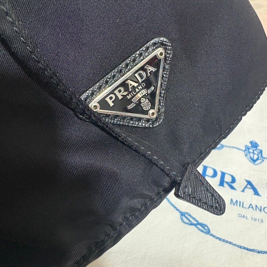 Authentic Prada Drawstring Pouch (Category: Luxury Bags & Wallets) located in Binangonan. Submitted by makoleksyon (Listing ID 1439968262, Image 3). Description: Both Brand New condition 10/10 color rate Black -18500 Hot Pink -18500 Comes with dust bag and free bag inside organizer Pwede lagyan ng chain strap para maging shoulder bag or cross body bag Bought in Japan 💯% Authentic Money back guarantee .