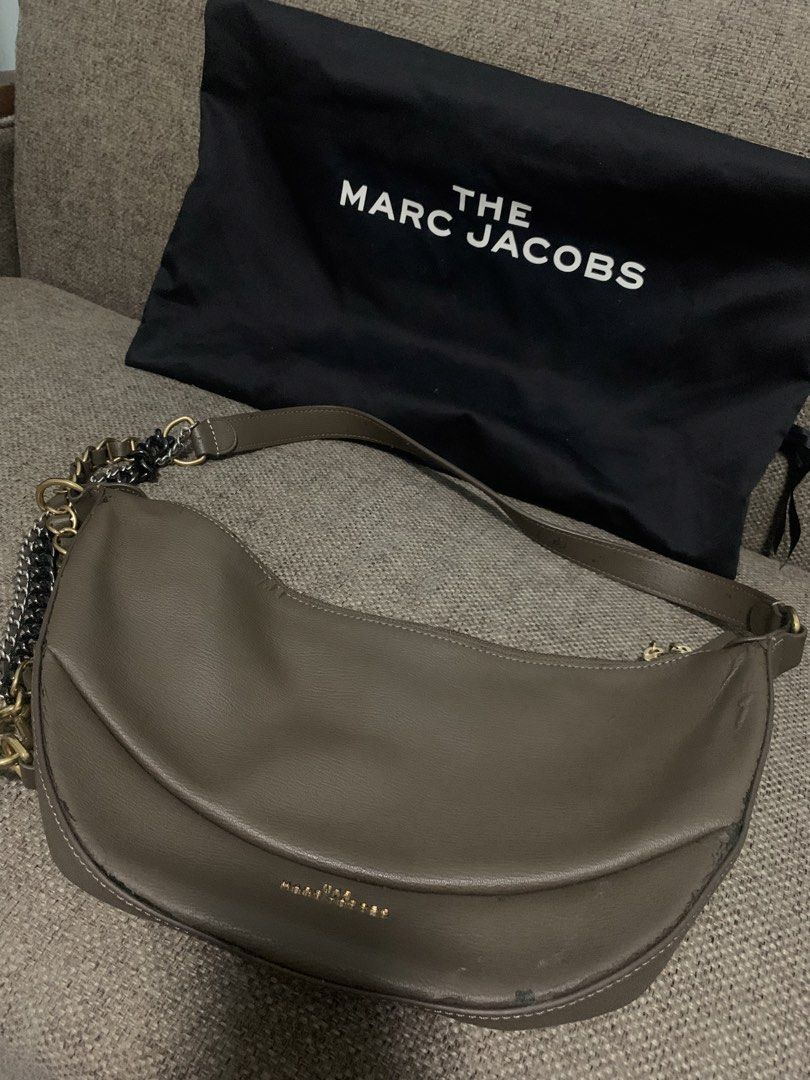 Authentic The Marc Jacobs Crescent/Eclipse Bag (Category: Luxury Bags & Wallets) located in Manila. Submitted by clarisse.preloved (Listing ID 1439968950, Image 1). Description: -Authentic Marc Jacobs Eclipse bag -Used with visible leather cracking/peeling on edges (see photos). -Hardware, zipper, and strap all working well. -No rust/tarnish. -Comes with original dust bag. -Great everyday/Y2K shoulder bag..