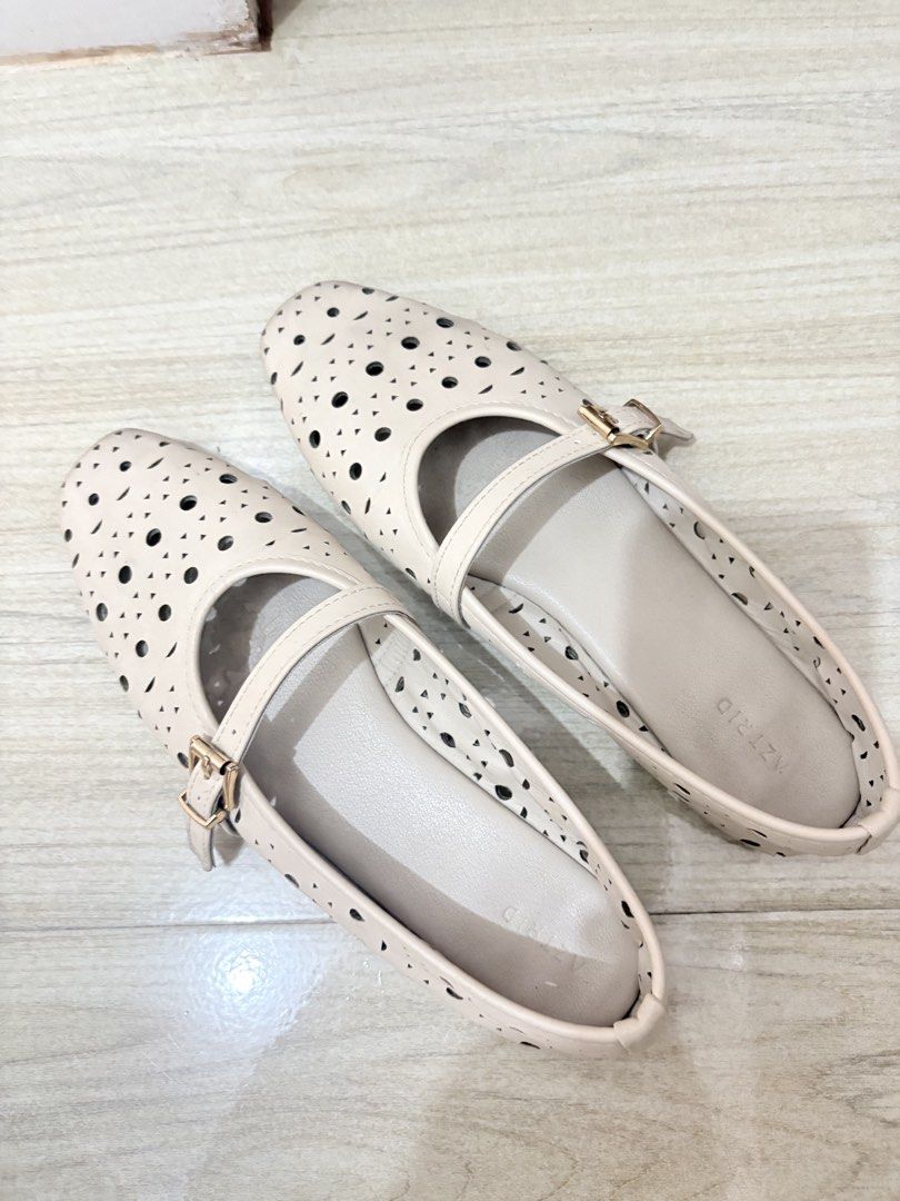 AZTRID Beige Perforated Mary Jane Flats with Buckle Strap (Category: Flats & Sandals) located in Muntinlupa City. Submitted by things_corner_ph (Listing ID 1439932380, Image 1). Description: - Brand: AZTRID - Style: Mary Jane Flats - Color: Beige - may peeled off lang sa isang part ng shoe nasa last pic - size: 8.