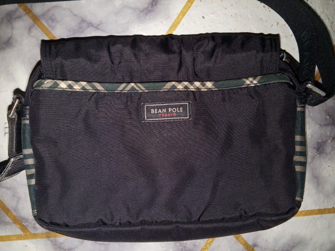 Bean Pole small unisex sling nylon Bag (Category: Luxury Bags & Wallets) located in Bulacan. Submitted by keroro1982 (Listing ID 1439841582, Image 2). Description: - Bean Pole messenger bag - Classic design - Plaid front flap - Black body - Adjustable long strap - Gold-toned button details - Bean Pole logo - Flap closure - Durable material.