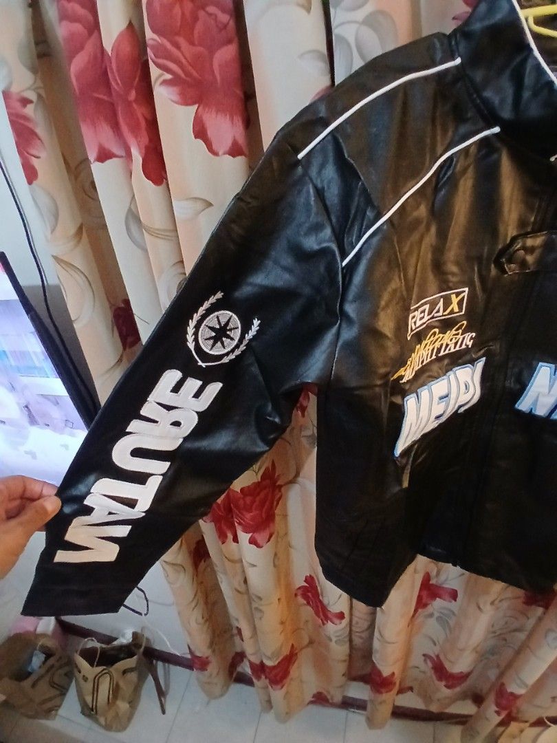 Black Racing Jacket with "Nature" and "Meipi" Graphics (Category: Coats, Jackets and Outerwear) located in Manila. Submitted by jaypeealb14603 (Listing ID 1439967997, Image 3). Description: - Stylish black racing jacket - Bold white and blue graphics - Features text: "Nature", "Studio", "Relax", "Meipi" - White piping accents - Perfect for a sporty and edgy look.