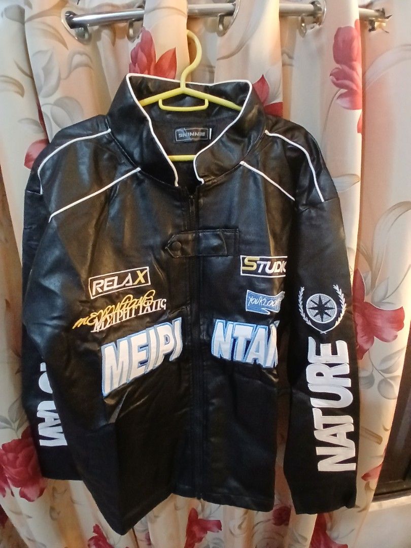 Black Racing Jacket with "Nature" and "Meipi" Graphics (Category: Coats, Jackets and Outerwear) located in Manila. Submitted by jaypeealb14603 (Listing ID 1439967997, Image 1). Description: - Stylish black racing jacket - Bold white and blue graphics - Features text: "Nature", "Studio", "Relax", "Meipi" - White piping accents - Perfect for a sporty and edgy look.