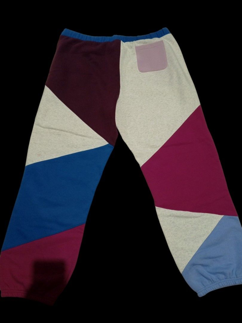 Champion Classic Fleece Patchwork Sweatpants 2X-Large (Category: Joggers) located in Guagua. Submitted by mrkrygn (Listing ID 1439948724, Image 2). Description: - Comfortable Champion sweatpants - Unique patchwork design in burgundy, blue, and grey - Made with classic fleece for warmth and softness - Features a drawstring waist for adjustable fit - Includes a convenient back pocket - Perfect for casual outings or lounging at home.