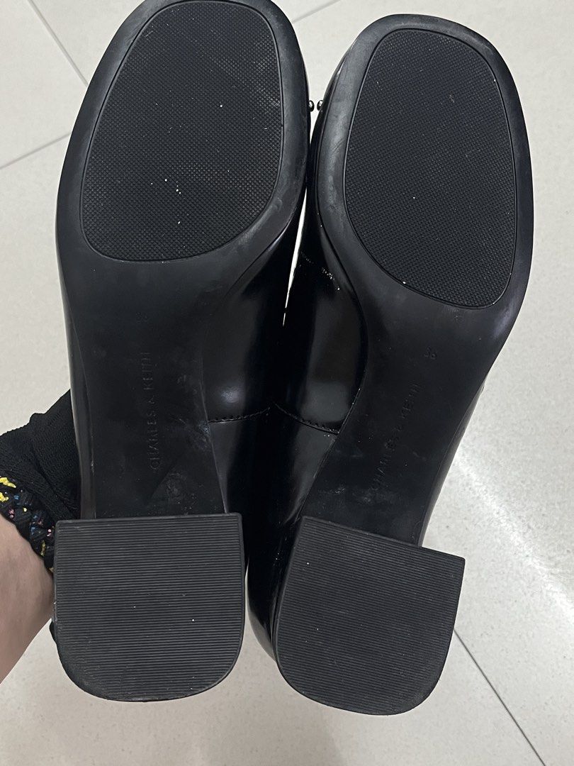 Charles & Keith Studded Mary Jane Heels (Category: Heels) located in Bulacan. Submitted by sef19 (Listing ID 1439836881, Image 2). Description: - Black Charles & Keith heels - Mary Jane style with strap - Studded details - Size 36 - Block heel - Glossy finish - Black soles with Charles & Keith branding.