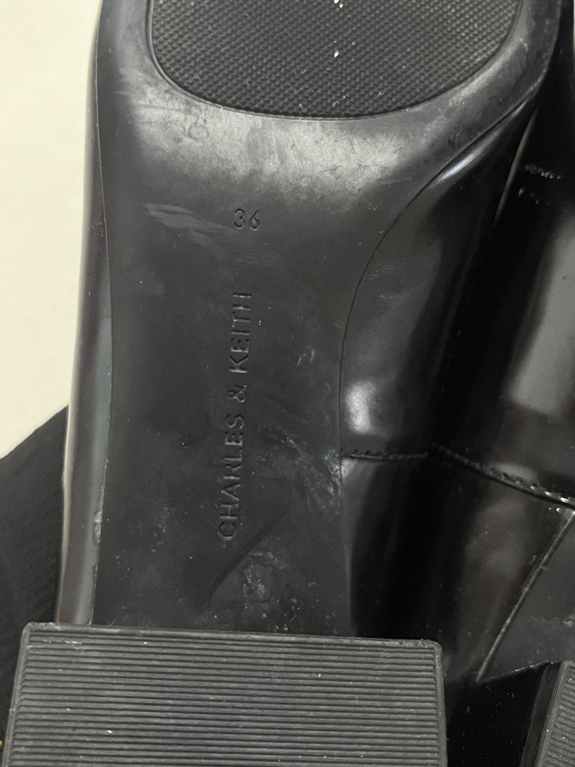 Charles & Keith Studded Mary Jane Heels (Category: Heels) located in Bulacan. Submitted by sef19 (Listing ID 1439836881, Image 3). Description: - Black Charles & Keith heels - Mary Jane style with strap - Studded details - Size 36 - Block heel - Glossy finish - Black soles with Charles & Keith branding.