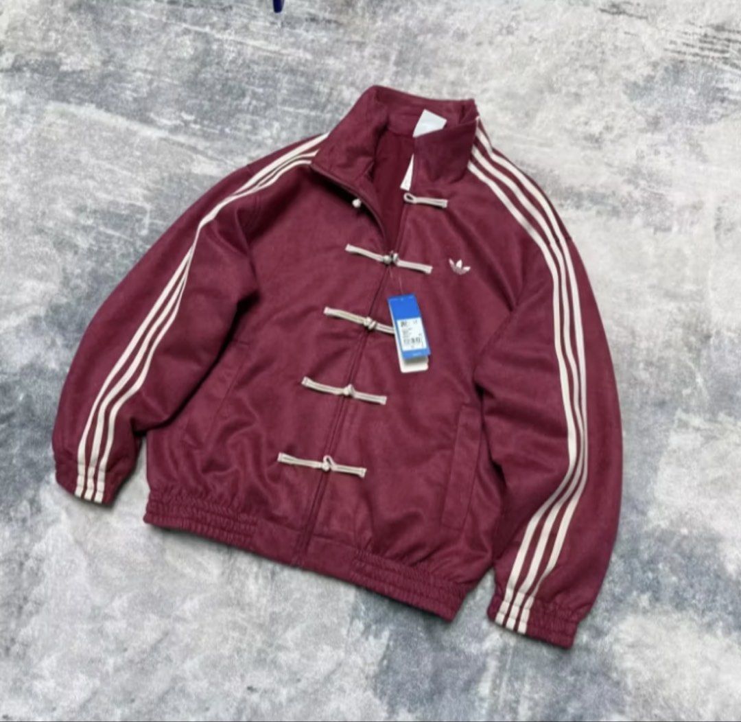 Chinese New Year Adidas Track Jacket (Category: Coats, Jackets and Outerwear) located in Pasay City. Submitted by desharoww (Listing ID 1439964117, Image 2). Description: (REPOSTED LISTING) Viral Premium one-to-one quality Chinese New Year jacket (Adidas-inspired) — straight from China 🇨🇳 Clean stitching, premium suede-like finish, high-grade materials, and perfect fit. Detailed embroidery and quality cuffs just like OG. ✨ NEW COLORS ADDED ✨ No