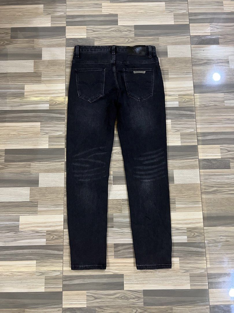 Chrome Hearts Black Denim Jeans (Category: Jeans) located in Iba. Submitted by saploot (Listing ID 1439962074, Image 3). Description: - Stylish black denim jeans - 30-34x39 - Features iconic Chrome Hearts cross motif - Washed-out effect for a vintage look - Comfortable fit, perfect for everyday wear - Subtle detailing on front and back pockets.