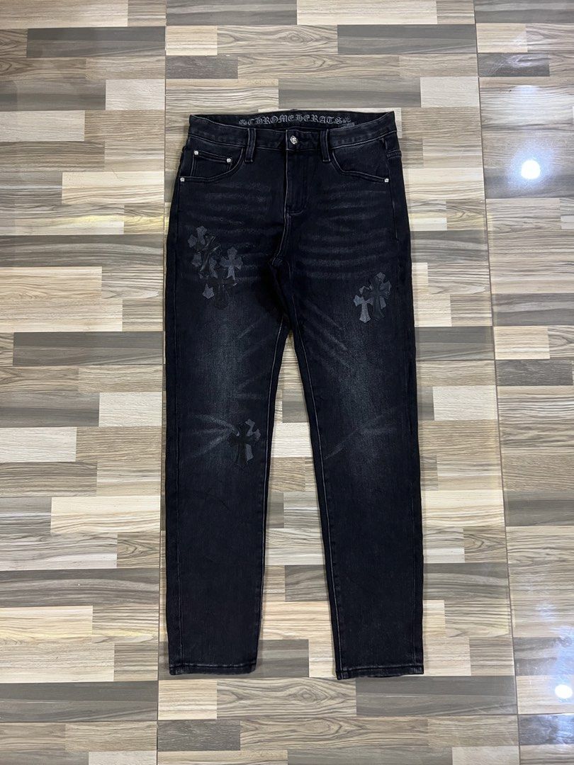 Chrome Hearts Black Denim Jeans (Category: Jeans) located in Iba. Submitted by saploot (Listing ID 1439962074, Image 1). Description: - Stylish black denim jeans - 30-34x39 - Features iconic Chrome Hearts cross motif - Washed-out effect for a vintage look - Comfortable fit, perfect for everyday wear - Subtle detailing on front and back pockets.
