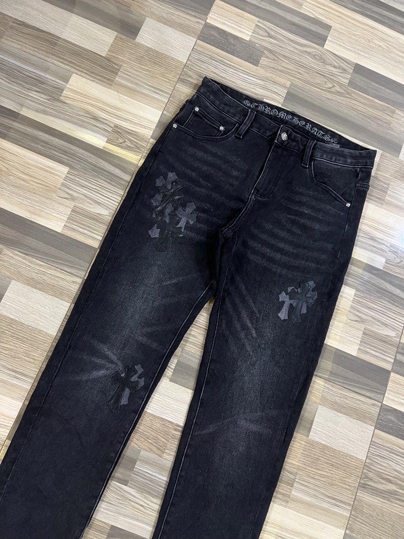 Chrome Hearts Black Denim Jeans (Category: Jeans) located in Iba. Submitted by saploot (Listing ID 1439962074, Image 2). Description: - Stylish black denim jeans - 30-34x39 - Features iconic Chrome Hearts cross motif - Washed-out effect for a vintage look - Comfortable fit, perfect for everyday wear - Subtle detailing on front and back pockets.
