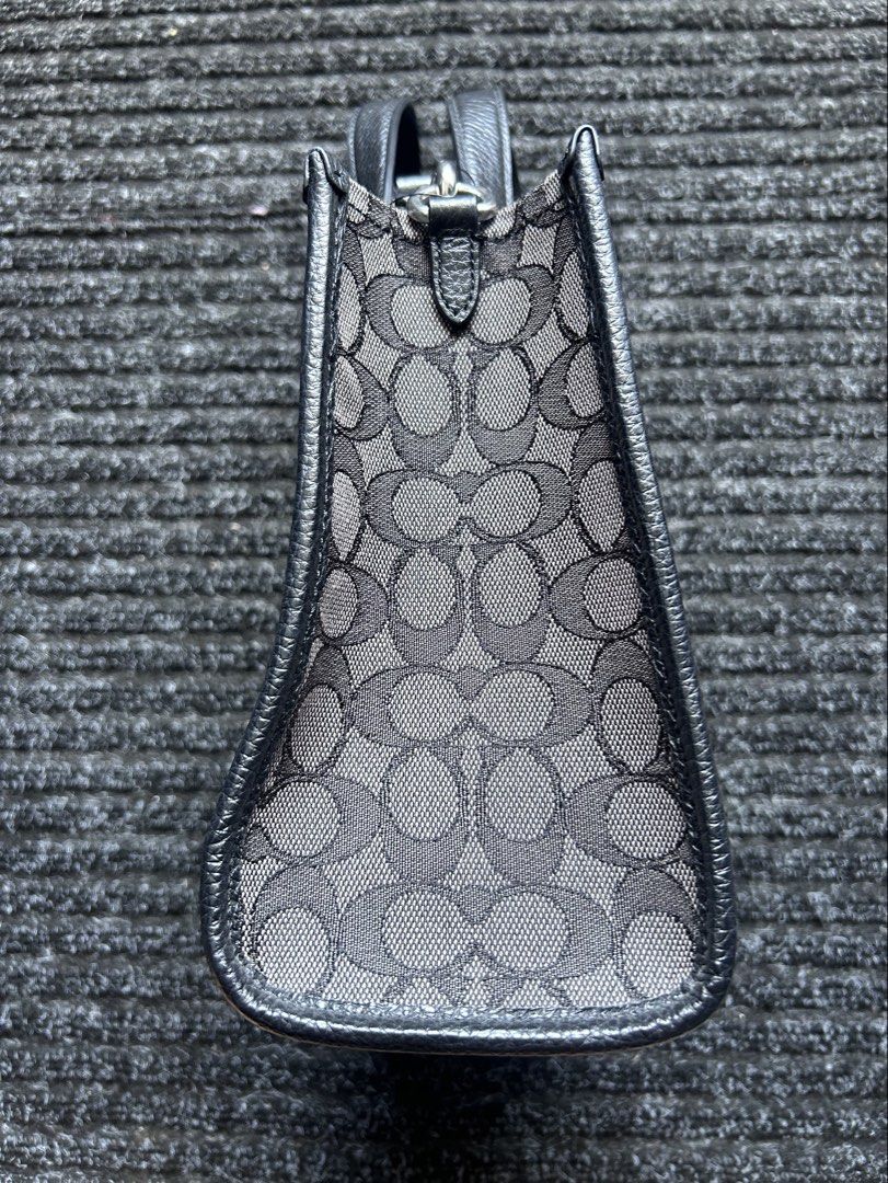 Coach Dempsey Tote 22 (Category: Luxury Bags & Wallets) located in Pasig City. Submitted by califinestcollectibles (Listing ID 1439829987, Image 2). Description: Coach Dempsey Tote 22 in black signature jacquard with a central stripe and patch. Height: 20 cm Width: 12cm Length: 22cm Original/Authentic Actual and Detailed Pictures are Posted Pick Up at One Oasis condominium ortigas extension pasig city Or Delivery via Lalamove,Jnt, LBC cod/cop JNT