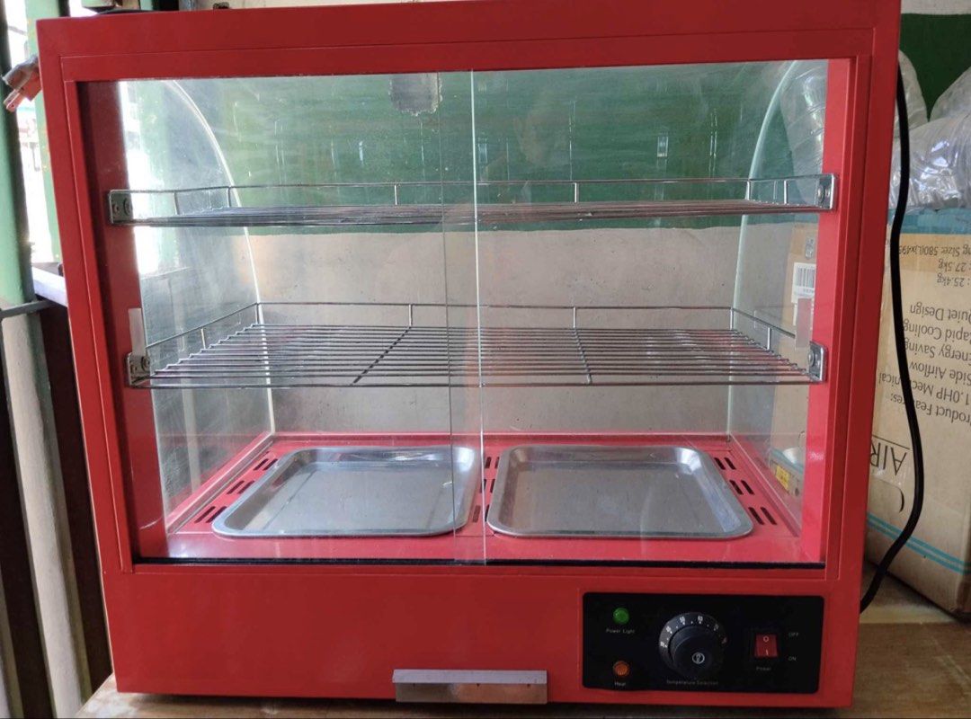 Commercial Food Warmer Display (Category: Food Organization & Storage) located in Quezon City. Submitted by QC_jades (Listing ID 1439814924, Image 3). Description: - Commercial food warmer - Two trays and two shelves - Red exterior with curved glass front - Temperature control knob - Keeps food warm and ready to serve - Perfect for small businesses and home use.