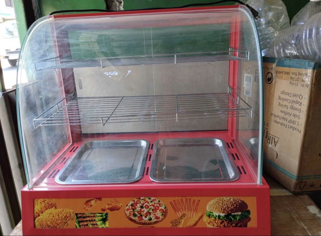 Commercial Food Warmer Display (Category: Food Organization & Storage) located in Quezon City. Submitted by QC_jades (Listing ID 1439814924, Image 2). Description: - Commercial food warmer - Two trays and two shelves - Red exterior with curved glass front - Temperature control knob - Keeps food warm and ready to serve - Perfect for small businesses and home use.