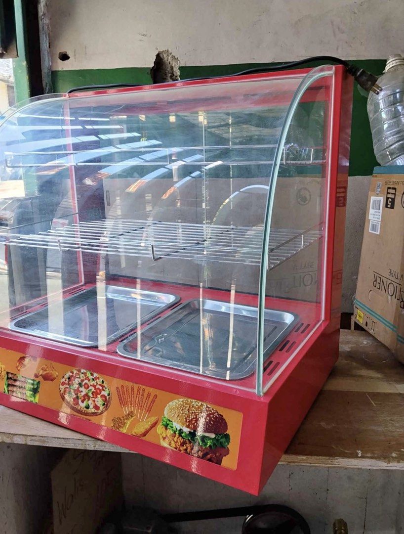 Commercial Food Warmer Display (Category: Food Organization & Storage) located in Quezon City. Submitted by QC_jades (Listing ID 1439814924, Image 1). Description: - Commercial food warmer - Two trays and two shelves - Red exterior with curved glass front - Temperature control knob - Keeps food warm and ready to serve - Perfect for small businesses and home use.