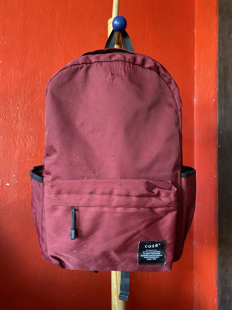 COSĒ red waterproof big backpack unisex school bag (Category: Backpacks) located in Imus. Submitted by fyema (Listing ID 1439844119, Image 1). Description: condition on pics imus cavite loc gcash jnt lalamove.