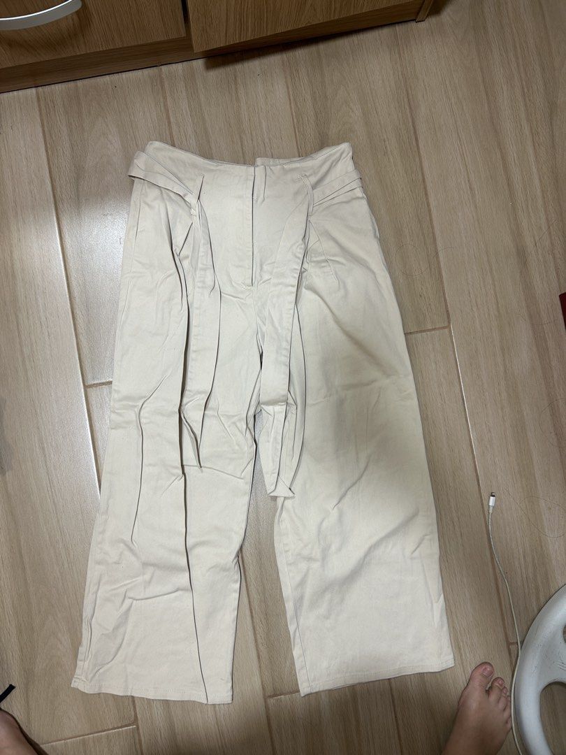 Cotton On Beige Wide Leg Pants (Category: Other Bottoms) located in Makati City. Submitted by ckvdeclutter (Listing ID 1439827113, Image 1). Description: - Cotton On beige wide-leg pants - High-waisted design - Features a tie detail - Relaxed fit - Ideal for casual wear - Size: 10 (AUS), 6 (USA), 38 (EUR), 40 (BRZ).