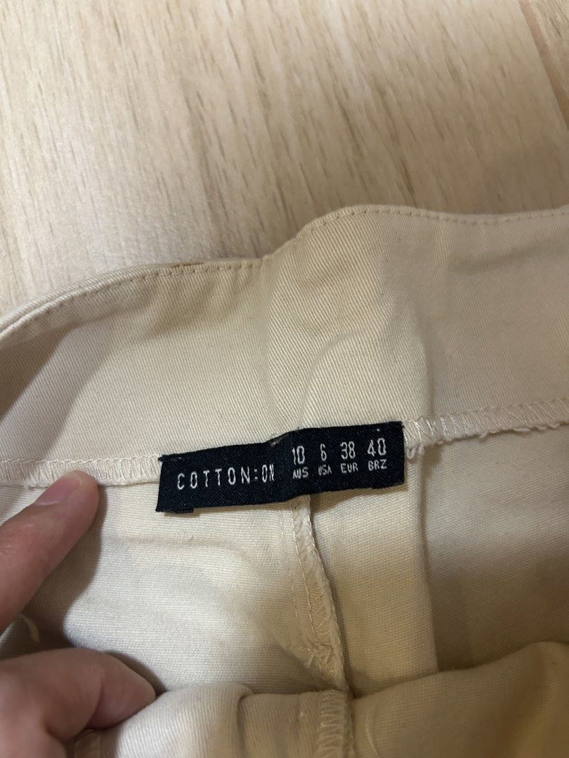 Cotton On Beige Wide Leg Pants (Category: Other Bottoms) located in Makati City. Submitted by ckvdeclutter (Listing ID 1439827113, Image 2). Description: - Cotton On beige wide-leg pants - High-waisted design - Features a tie detail - Relaxed fit - Ideal for casual wear - Size: 10 (AUS), 6 (USA), 38 (EUR), 40 (BRZ).