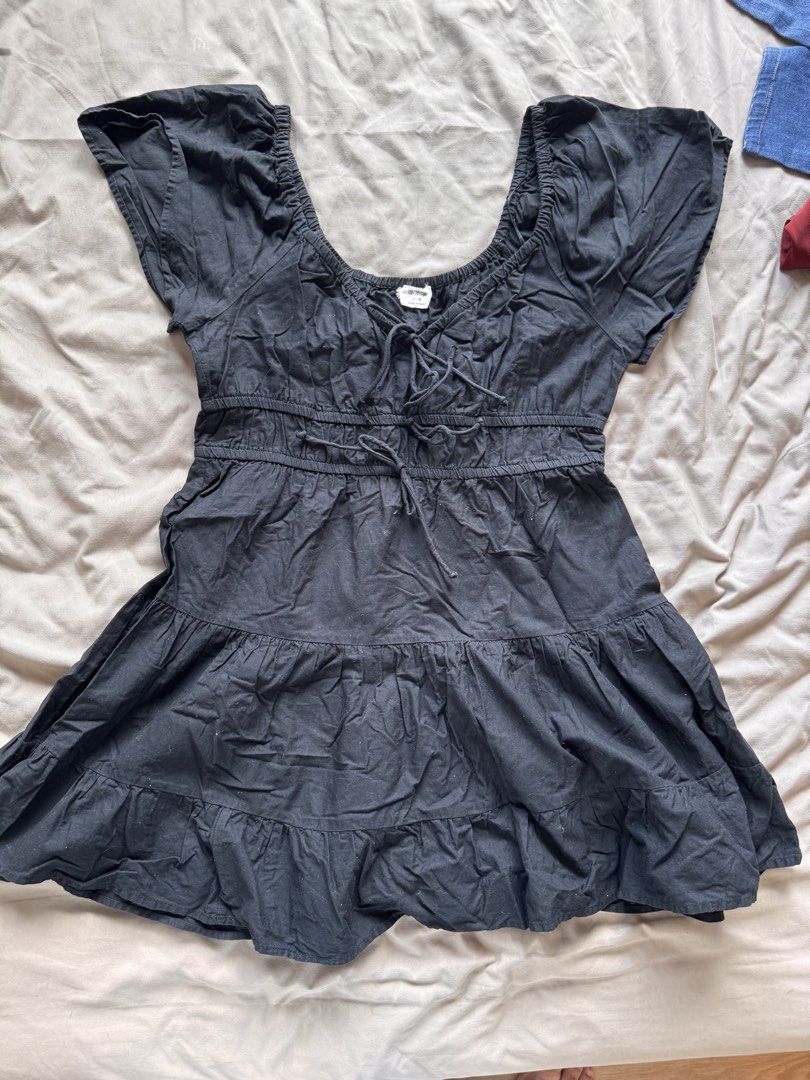 Cotton On Tiered Dress - Large (Category: Dresses) located in Mandaluyong City. Submitted by poblador.kimmy (Listing ID 1439866541, Image 1). Description: - Cotton On black tiered dress - Size: Large - Features: - Square neckline - Tie detail at bust - Elasticated waist - Short sleeves - Flared skirt - Made in India.