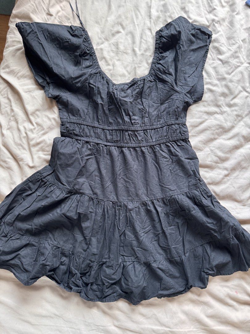 Cotton On Tiered Dress - Large (Category: Dresses) located in Mandaluyong City. Submitted by poblador.kimmy (Listing ID 1439866541, Image 2). Description: - Cotton On black tiered dress - Size: Large - Features: - Square neckline - Tie detail at bust - Elasticated waist - Short sleeves - Flared skirt - Made in India.