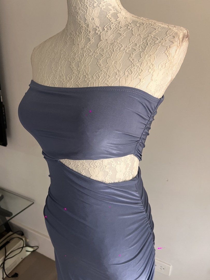 Cut-Out Maxi Dress (Category: Dresses) located in Makati City. Submitted by secondmuse_ (Listing ID 1439865208, Image 3). Description: - Muted blue-grey maxi dress - Strapless design - Unique waist cut-out - Ruched texture - Form-fitting silhouette - Ideal for special events and evening wear.