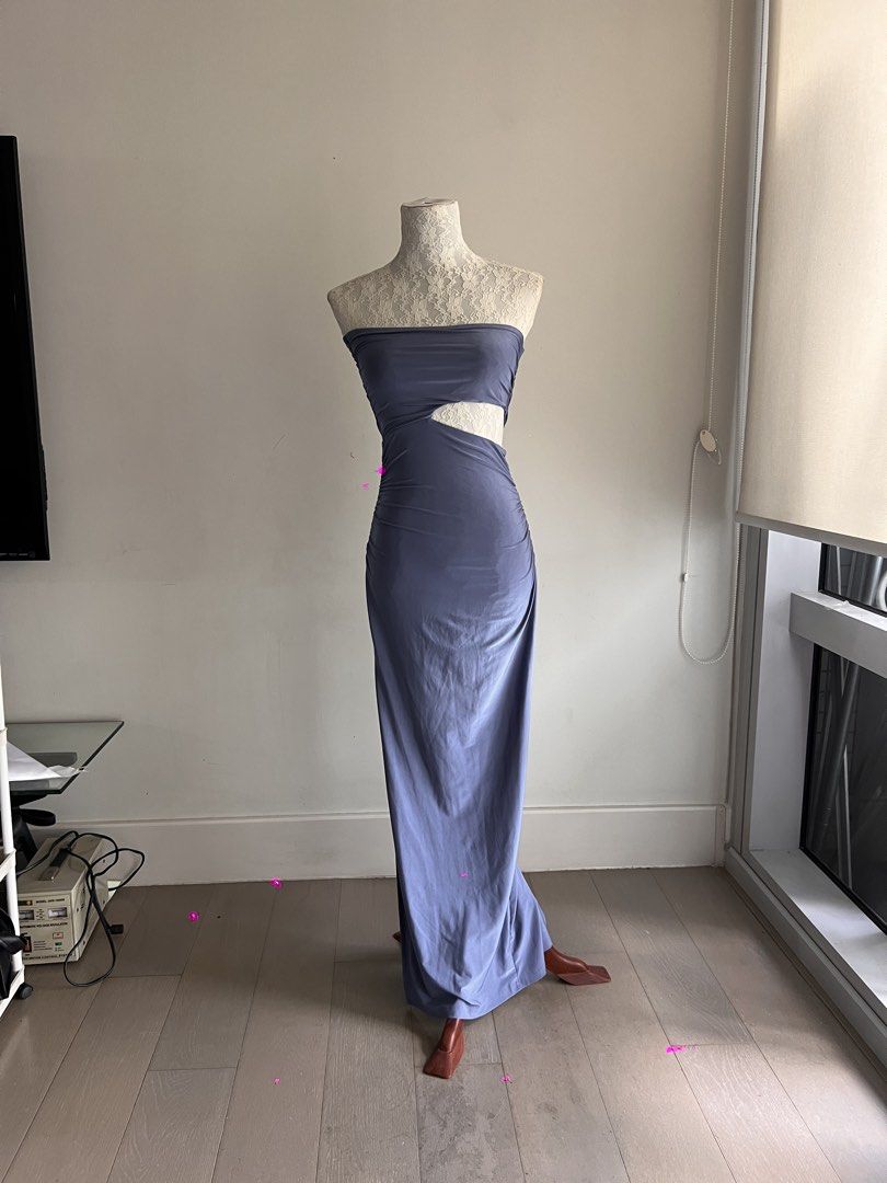 Cut-Out Maxi Dress (Category: Dresses) located in Makati City. Submitted by secondmuse_ (Listing ID 1439865208, Image 2). Description: - Muted blue-grey maxi dress - Strapless design - Unique waist cut-out - Ruched texture - Form-fitting silhouette - Ideal for special events and evening wear.