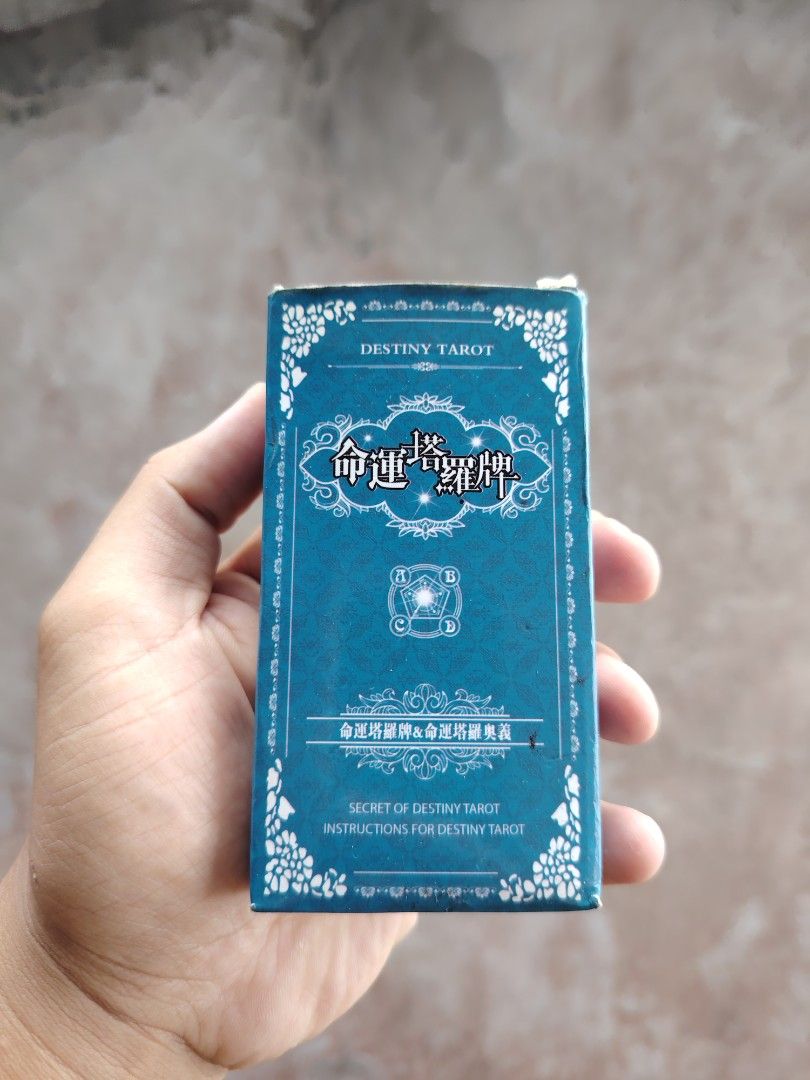 Destiny Tarot Cards Deck (Category: Storybooks) located in Baguio. Submitted by lukewarmwaterboy (Listing ID 1439899645, Image 1). Description: - Vibrant teal box with intricate white floral patterns - Text in both English and Chinese - Includes instruction booklet - Features colorful illustrated cards - Destiny Tarot deck.