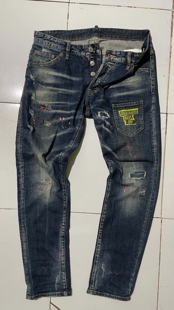 DSQUARED2 "Cool Guy Fit" Distressed Wash Jeans (Category: Jeans) located in Barotac Nuevo. Submitted by gray101 (Listing ID 1439932236, Image 2). Description: - Authentic DSQUARED2 jeans - Distressed wash with paint splatters and ripped details - Button fly closure - Classic five-pocket styling - Branded patch on coin pocket - Perfect for an edgy, casual look.