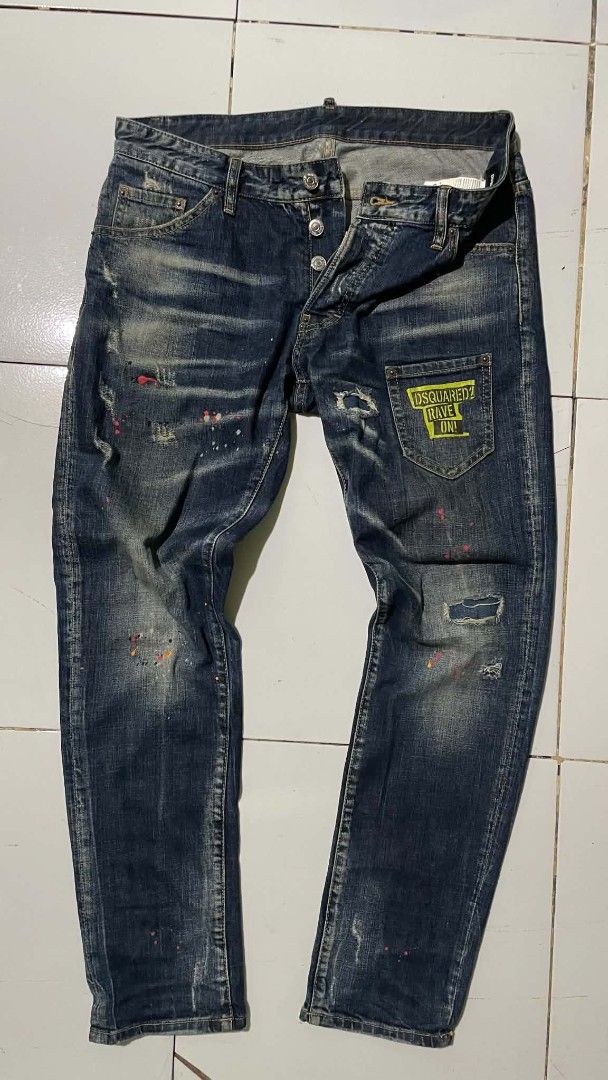 DSQUARED2 "Cool Guy Fit" Distressed Wash Jeans (Category: Jeans) located in Barotac Nuevo. Submitted by gray101 (Listing ID 1439932236, Image 1). Description: - Authentic DSQUARED2 jeans - Distressed wash with paint splatters and ripped details - Button fly closure - Classic five-pocket styling - Branded patch on coin pocket - Perfect for an edgy, casual look.