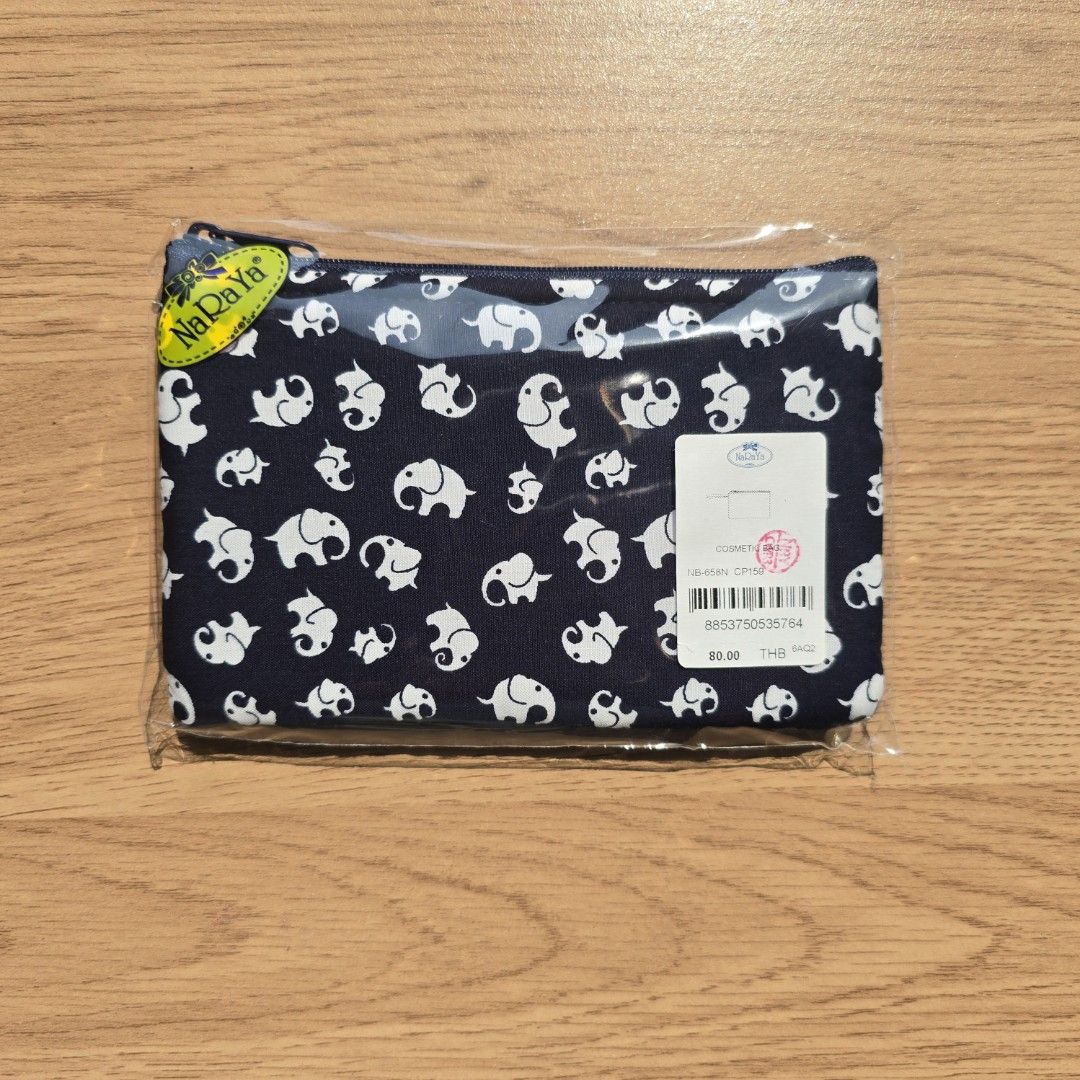 Elephant Print Pouch (Category: Purses & Pouches) located in Quezon City. Submitted by declutterwithnic (Listing ID 1439864589, Image 1). Description: - Brand new Nraya pouch - Features an adorable elephant print - Navy blue color - Secure zipper closure - Ideal for cosmetics and accessories - Compact size - Great gift idea.