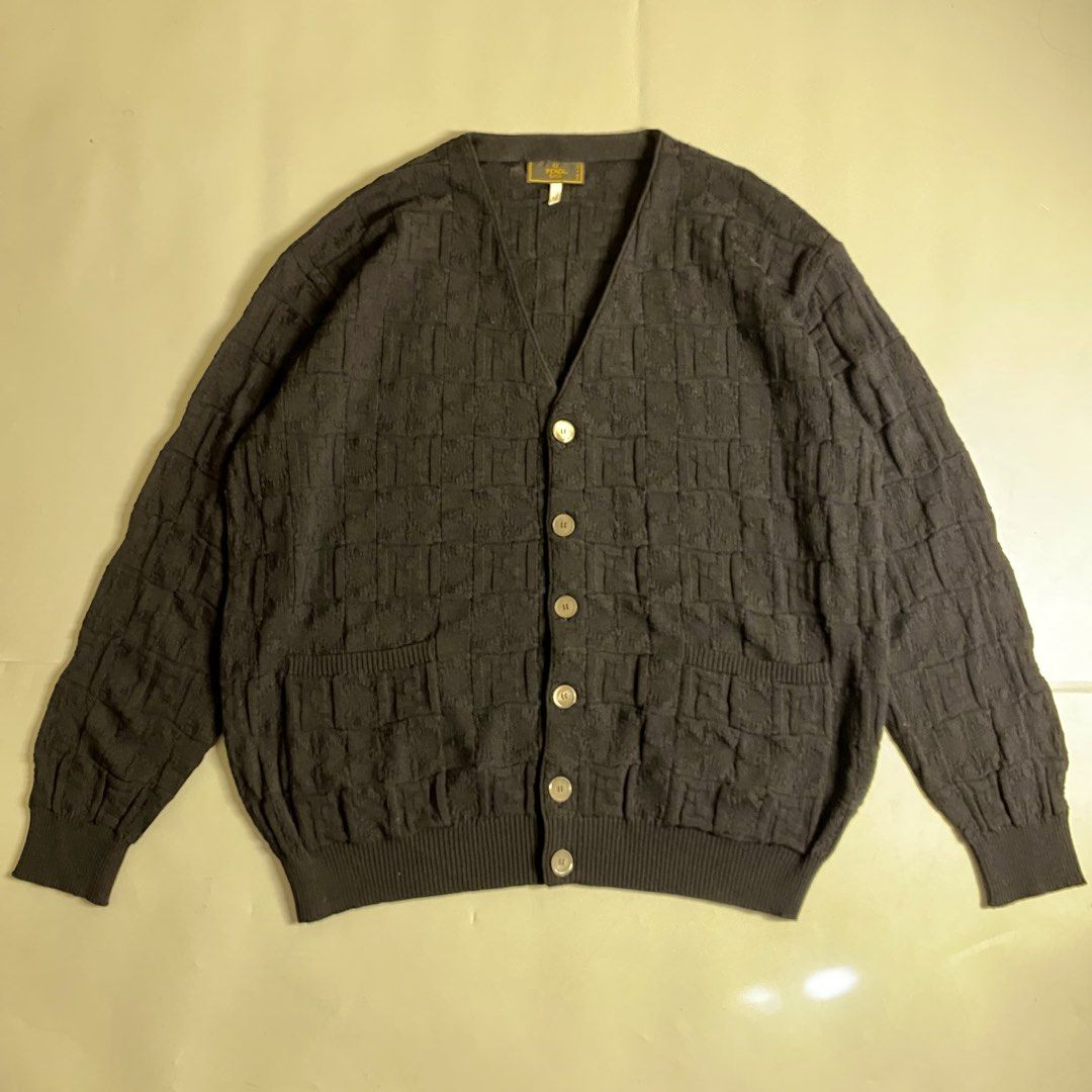 Fendi Zucca monogram textured wool cardigan (Category: Luxury Apparel) located in Cebu City. Submitted by streetguruthrift (Listing ID 1439815188, Image 1). Description: Fendi Zucca monogram textured wool cardigan ✨Featuring a classic V-neckline, front button closure, and dual patch pockets. The tone-on-tone basket-weave knit creates a raised, blocky variation of the iconic Fendi FF motif across the entire garment, offering a subtle yet distinct 
