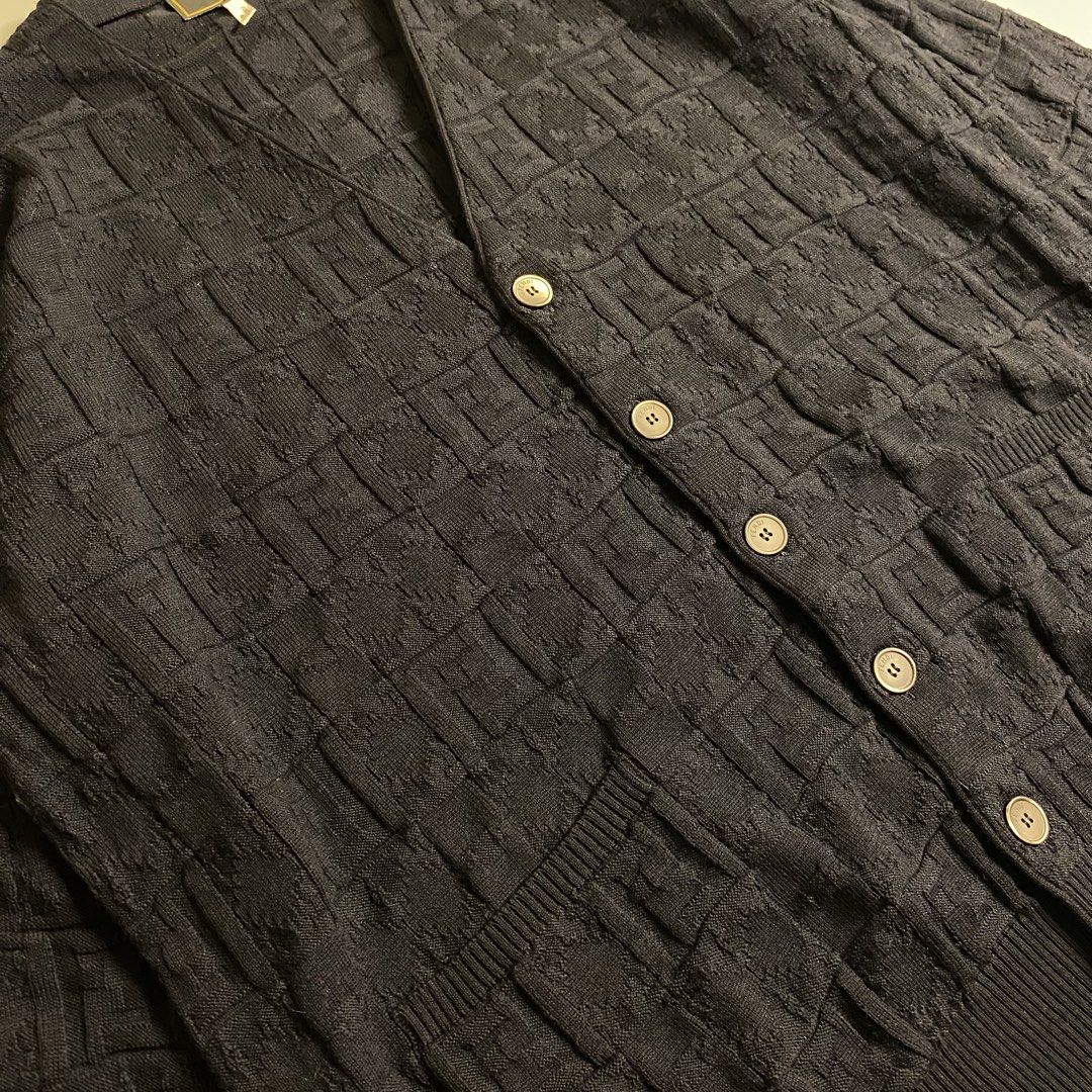 Fendi Zucca monogram textured wool cardigan (Category: Luxury Apparel) located in Cebu City. Submitted by streetguruthrift (Listing ID 1439815188, Image 2). Description: Fendi Zucca monogram textured wool cardigan ✨Featuring a classic V-neckline, front button closure, and dual patch pockets. The tone-on-tone basket-weave knit creates a raised, blocky variation of the iconic Fendi FF motif across the entire garment, offering a subtle yet distinct 