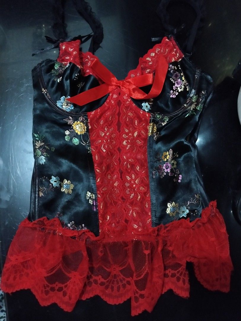 Floral Corset with Red Lace (Category: Undergarments & Loungewear) located in Quezon City. Submitted by carl_pam (Listing ID 1439882434, Image 1). Description: - Black satin corset - Floral embroidery - Red lace panel - Red lace trim used few times in good condition - Adjustable straps - Red bow detail - Lingerie piece.