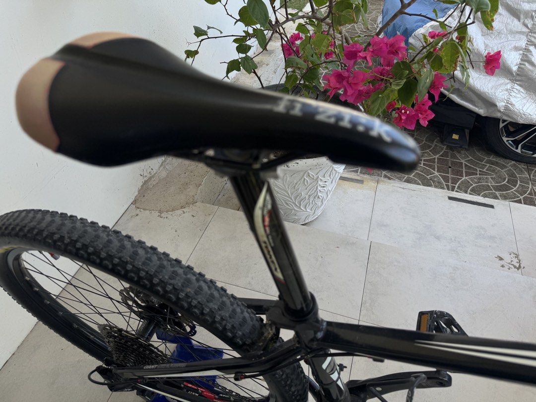 Giant Mountain Bike with Shimano XT Components (Category: Bicycles) located in Consolacion. Submitted by nalasho (Listing ID 1439869794, Image 3). Description: 26 inch Giant mountain bike features a black frame with white accents. It has Shimano XT group set 2x11 components, including derailleurs and crankset. The bike is equipped with disc brakes and a Fizik saddle. It has Maxxis tires and a Fox suspension fork..