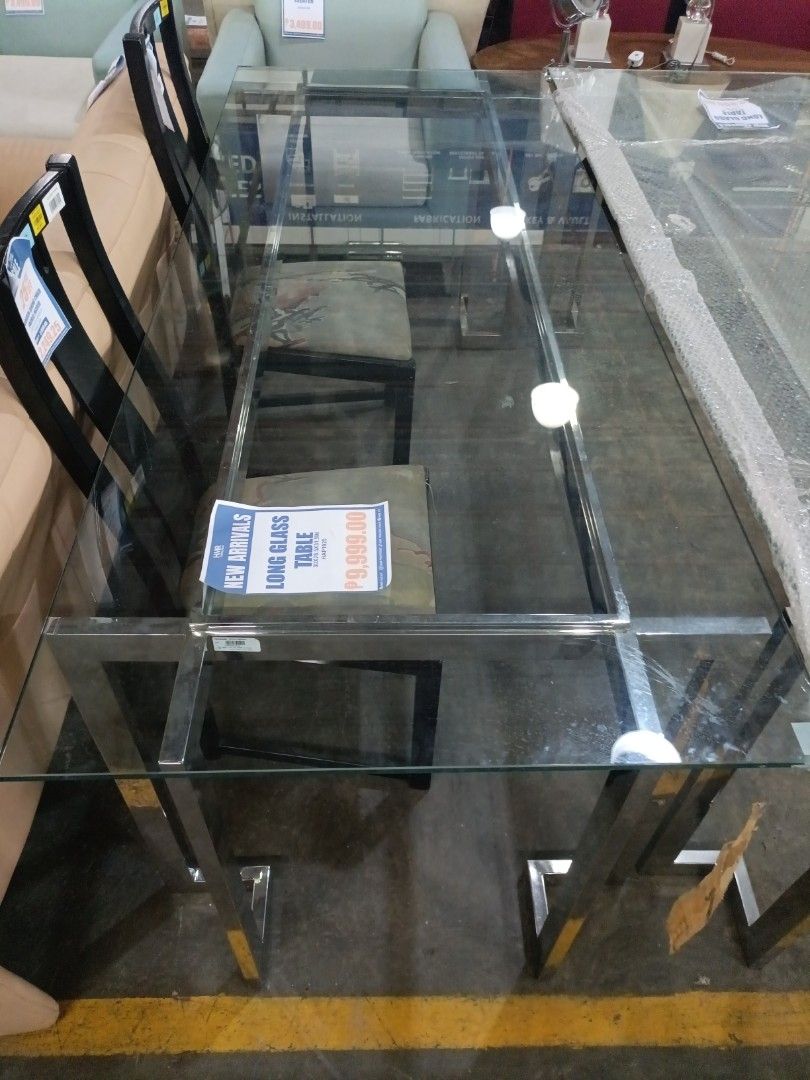 GLASS Long Glass Dining Table (Category: Tables & Sets) located in Paranaque City. Submitted by materesadimasaca (Listing ID 1439838988, Image 1). Description: - Brand new rectangular dining table. - Features an elegant glass top. - Durable stainless steel frame. - Modern design. - Spacious enough for multiple chairs. - Ideal for dining and entertaining..