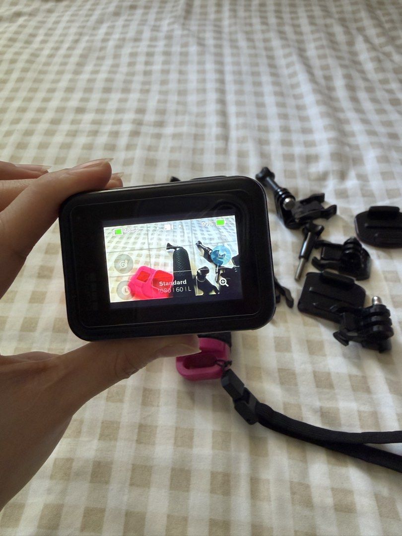 GoPro Hero 8 Black (Category: Cameras) located in Muntinlupa City. Submitted by pineapplejuz (Listing ID 1439836788, Image 2). Description: - Black GoPro action camera - Pink protective case - Includes various mounting accessories - Hand grip included - Memory card not included - No issues - Screen protected since day 1.