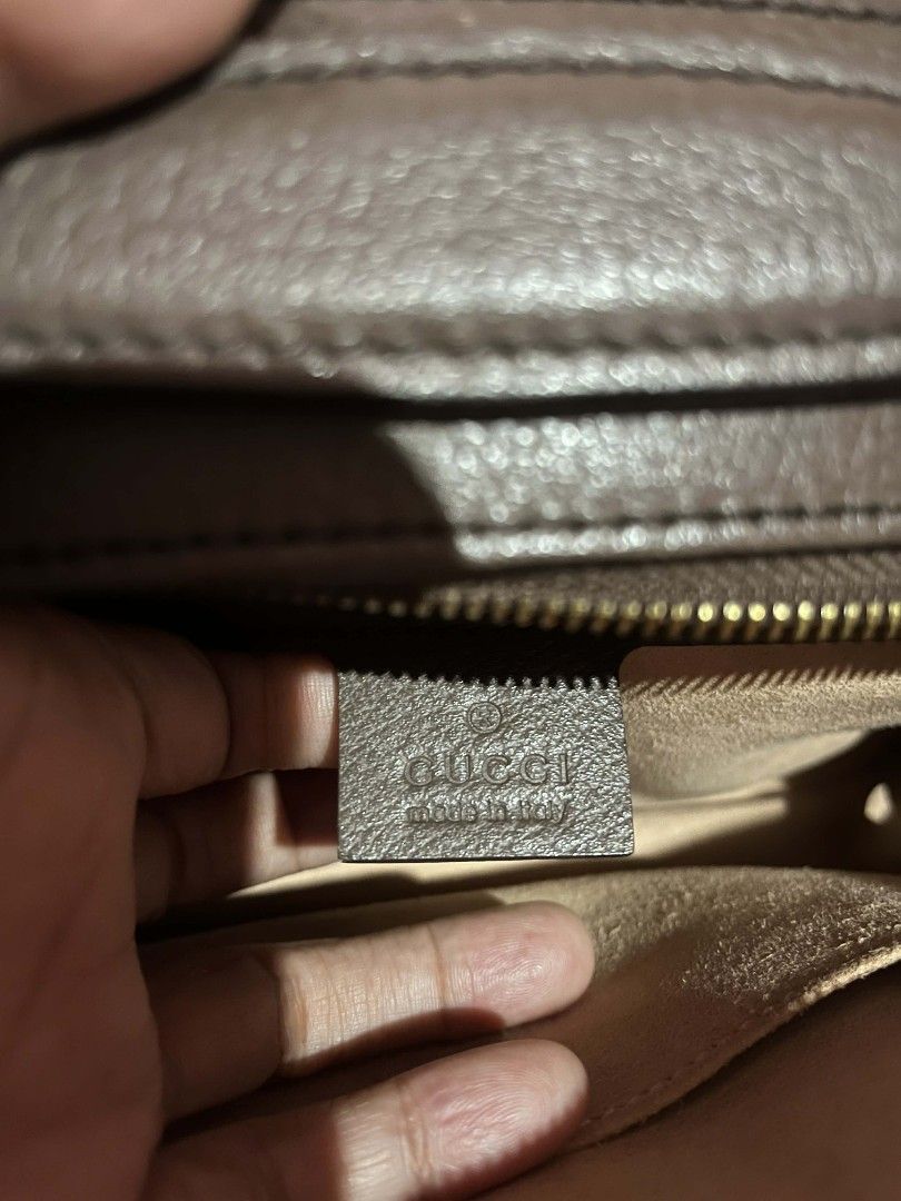 Gucci GG Supreme Shoulder Bag (Category: Luxury Bags & Wallets) located in Urdaneta. Submitted by ilovemomohiraii (Listing ID 1439828912, Image 2). Description: - Authentic Gucci shoulder bag - Iconic GG Supreme canvas with red and green stripe - Brown leather trim - Detachable shoulder strap - Interior zippered pocket - Gucci logo and "Made in Italy" tag.