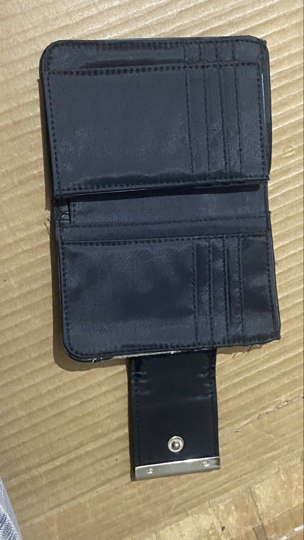 Guess Monogrammed Bifold Wallet with Coin Pouch (Category: Wallets & Card holders) located in Marilao. Submitted by coolpenguin.1935ba (Listing ID 1439896079, Image 3). Description: - Stylish Guess wallet with classic monogram pattern - Black leather trim for a sophisticated look - Bifold design for easy organization - Multiple card slots to hold all your cards - Clear ID window for quick access - Secure coin pouch with a snap closure BRAND: ByGe