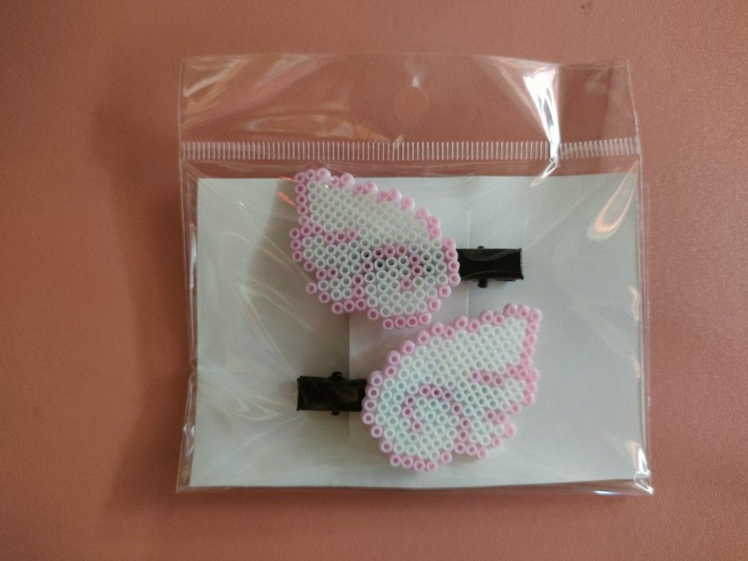 Handmade Perler Beads Hair Clips (Category: Hair) located in Manila. Submitted by clau1230 (Listing ID 1439971475, Image 2). Description: Handmade Perler Beads Hair Clips Add a cute and playful touch to your style with these handmade perler bead hair clips! Each piece is carefully crafted with love, making every design unique and perfect for everyday wear, gifts, or matching aesthetics. 🌸✨ Available designs: 🍓 Strawberry Clips 🐚 Shell Clips 💜