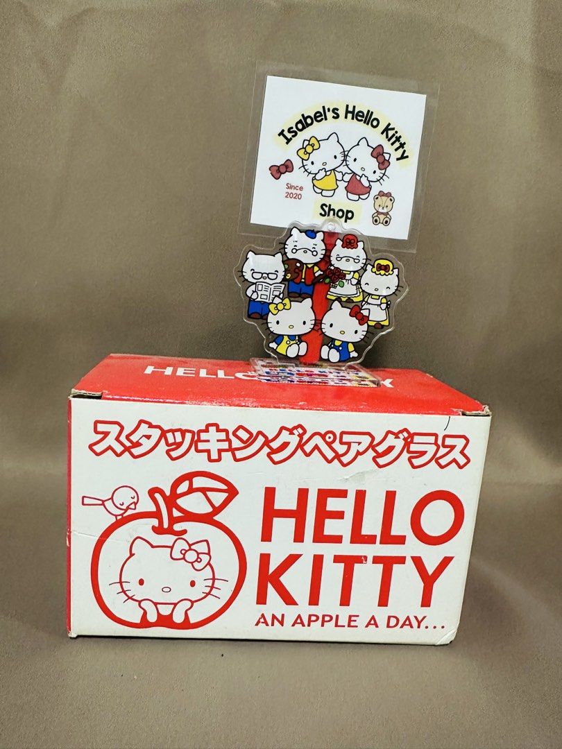Hello Kitty Pair Glass (Category: Other Kitchenware & Tableware) located in Angeles City. Submitted by IsaCRSL (Listing ID 1439842613, Image 1). Description: - Kitty stacking glasses - Features a red and white design - Adorned with Kitty and apple motifs - Comes with the original box (Japanese text) - Includes a Kitty acrylic stand.