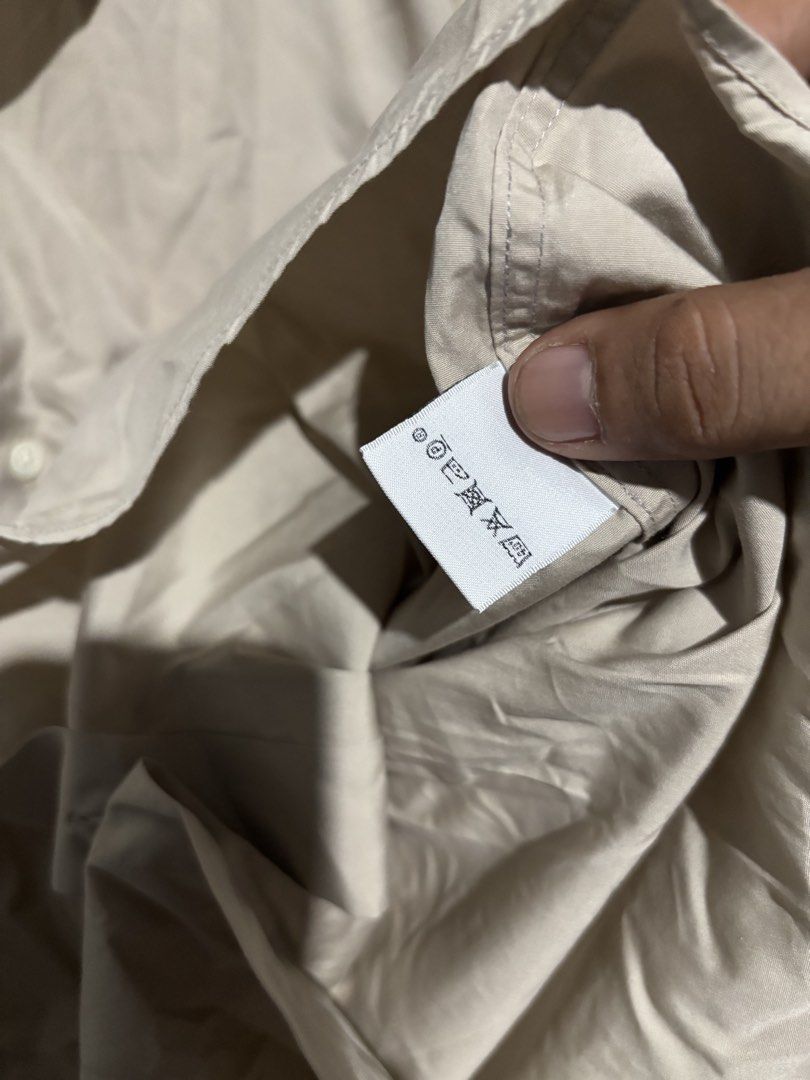 Hermes Beige Long Sleeve Shirt (Category: Luxury Apparel) located in Lopez. Submitted by thrift.ni.roms22 (Listing ID 1439818060, Image 3). Description: - Authentic Hermes long sleeve shirt - Color: Beige - Made in France - Size: 15/38 - Material: 100% cotton - Features a classic collar and button-down closure - A timeless wardrobe staple.