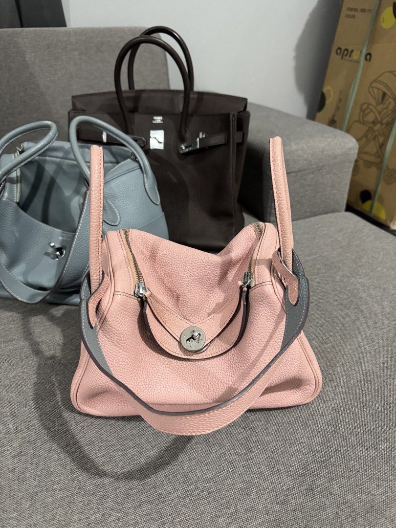 Hermes Lindy Bag Pink (Category: Luxury Bags & Wallets) located in Dagupan City. Submitted by thriftygoods.dagupan (Listing ID 1439890184, Image 1). Description: - Authentic Hermes Lindy Bag - Color: Pink with Grey Accents - Hardware: Silver-tone lock and zipper - Interior: Grey - Features: Two handles and a shoulder strap - Material: Textured leather - Condition: Good - Riri underzip.