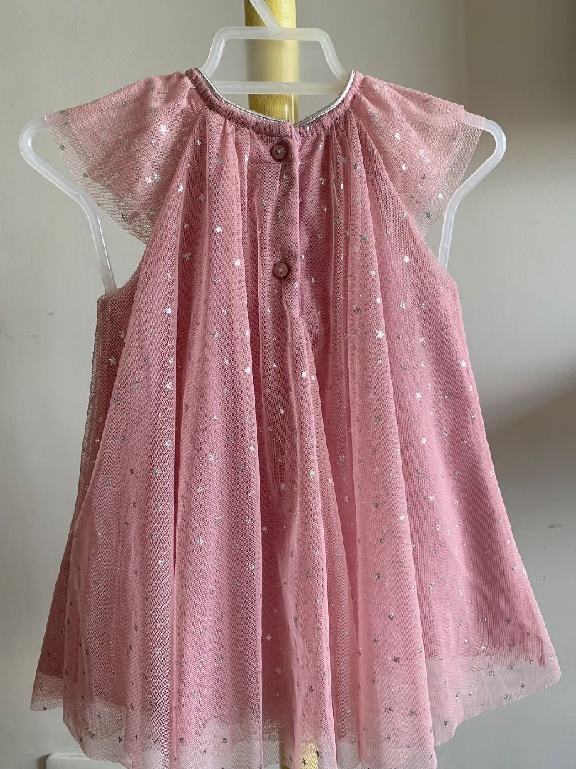 H&M Baby Girl Pink Tulle Dress with Silver Sparkles (Category: Babies & Kids Fashion) located in Quezon City. Submitted by warmrabbit_414908 (Listing ID 1439988667, Image 2). Description: - Adorable pink H&M baby dress - Delicate tulle overlay with scattered silver sparkles - Shimmering silver ribbon trim on neckline and sleeves - Perfect for special occasions or everyday wear.