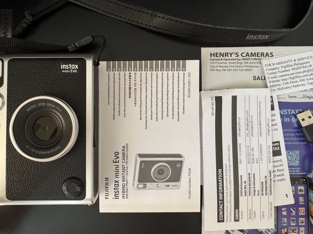 Instax Mini Evo (Category: Cameras) located in Manila. Submitted by preloveditemsxz (Listing ID 1439859639, Image 2). Description: Fujifilm Instax Mini Evo instant camera (black) - Produces instant prints - Bluetooth phone printer function - Can save photos digitally before printing -Rechargeable battery Inclusions: ✅Box ✅Manuals ✅Orig Strap ✅Receipt bought last Oct 2025 ✅Type C Charger ✅2 remaining films ✅32gb microSD RFS: Rarely used / declutte